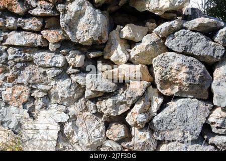 Old  bricks wall pattern. Medieval stone wall.  Background, texture Stock Photo