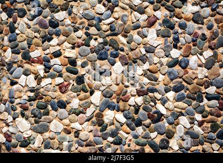 Small stone texture for background. Sea stones background. Texture Stock Photo