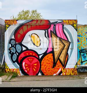 Artwork on Mega munch cafe on industrial site Stock Photo