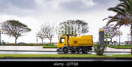 FUNCHAL, MADEIRA ISLAND - February 20, 2022: Truck Vacuum Cleaner for Street Cleaning. Funchal city street with after rain. Madeira Island Stock Photo