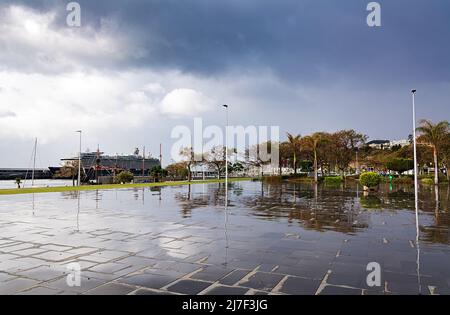 FUNCHAL, MADEIRA ISLAND - February 20, 2022: Urban landscape, embankment. Funchal city street with after rain. Madeira Island Stock Photo