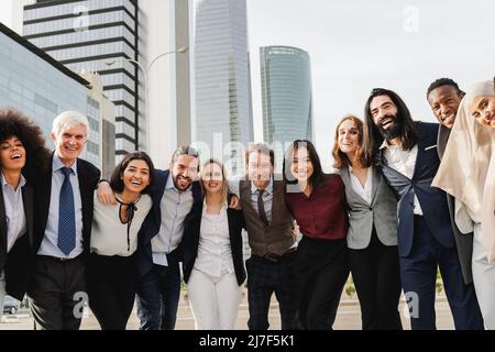 Multiracial group of business people having fun together outdoor - Entrepreneurs and colleagues smiling on camera Stock Photo