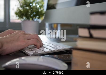 Female worker using computer in the office Stock Photo