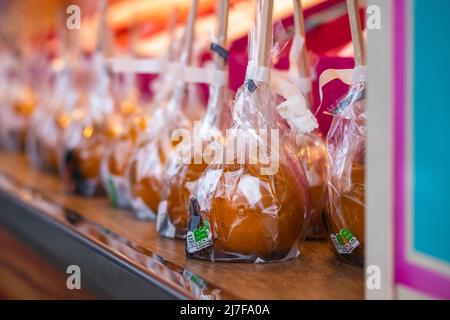 Toffee apples on display at Christmas market in Hyde Park Winter Wonderland in London Stock Photo