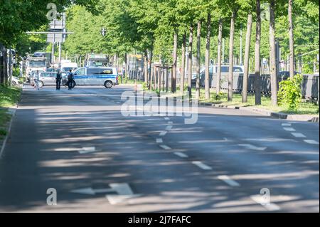 Leipzig, Germany. 09th May, 2022. A police vehicle stands on the road in front of the crosswalk where environmental activists from the group 'Last Generation' blocked rush hour traffic on Jahnallee this morning. The activists got stuck on the roadway. Police forces cordoned off the area and removed the demonstrators. In the west, traffic was backed up over a wide area. Credit: Christian Modla/dpa/Alamy Live News Stock Photo