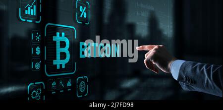Hand touching Bitcoin button. Modern business technology concept. Bitcoin, Ethereum Stock Photo