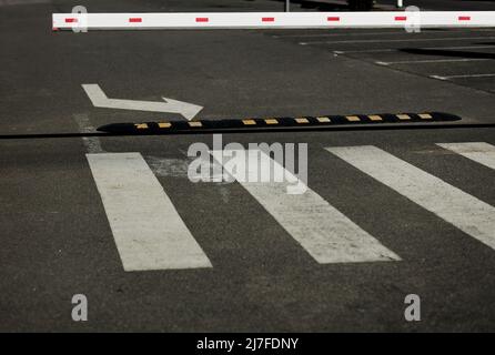 white and red Barrier in the parking lot. safety entrance pass Stock Photo