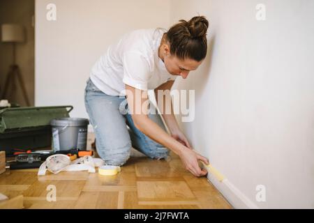 Woman renovating room Stock Photo