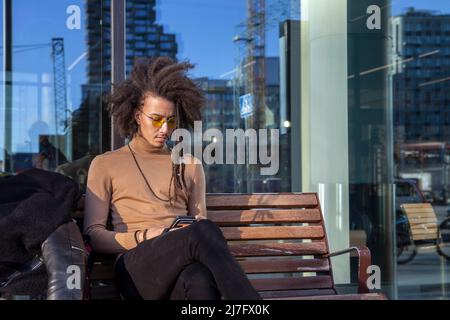 Young man using cell phone Stock Photo