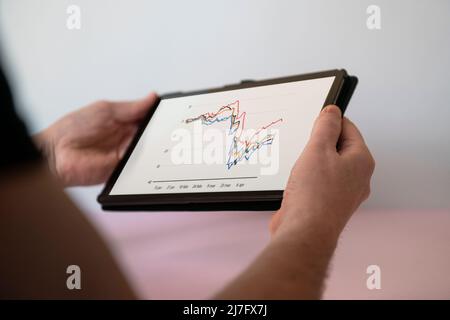 Hand holding digital tablet Stock Photo