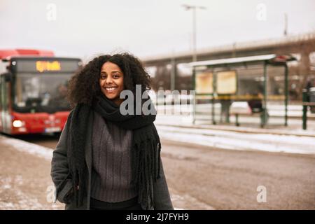 Smiling woman looking at camera Stock Photo