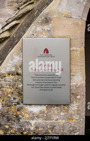 The Churches Conservation Trust plaque at entrance of St Arild in Oldbury on the Hill, Gloucestershire, UK Stock Photo