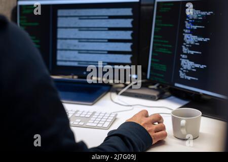 Male programmer working on computer Stock Photo