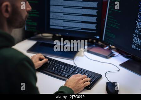 Male programmer working on computer Stock Photo