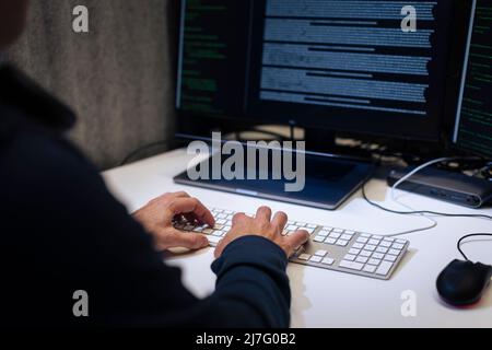 Male programmer working on computer Stock Photo