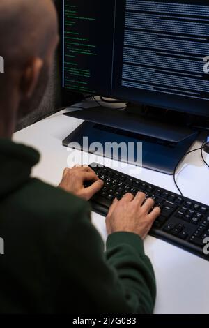 Male programmer working on computer Stock Photo