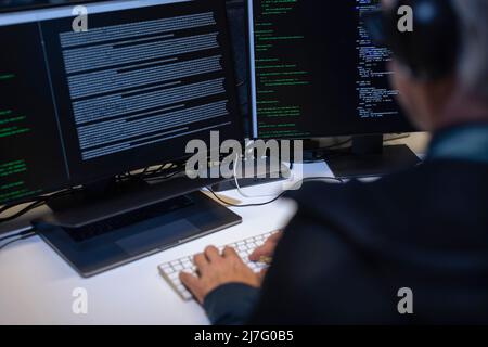 Male programmer working on computer Stock Photo