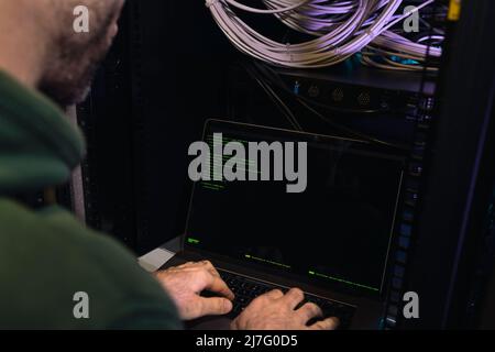 Male programmer working on laptop Stock Photo