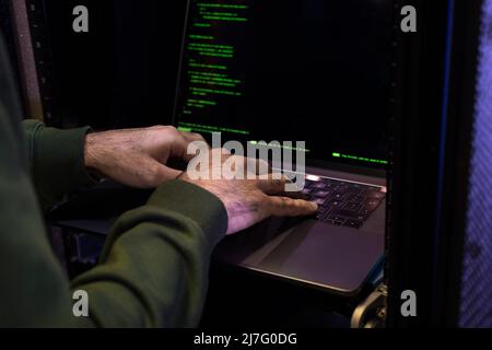 Male programmer working on laptop Stock Photo