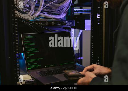 Male programmer working on laptop Stock Photo