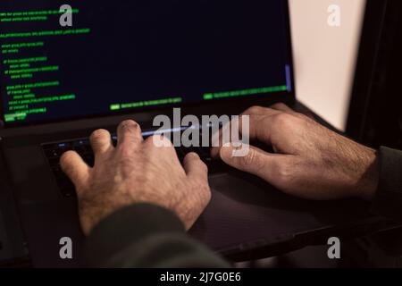 Male programmer working on laptop Stock Photo