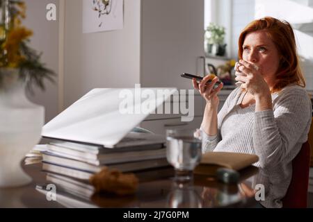 Woman having coffee break Stock Photo