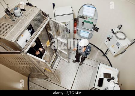Engineer working in wind turbine Stock Photo