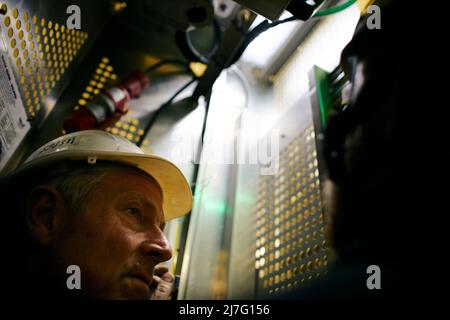 Engineer working in wind turbine Stock Photo