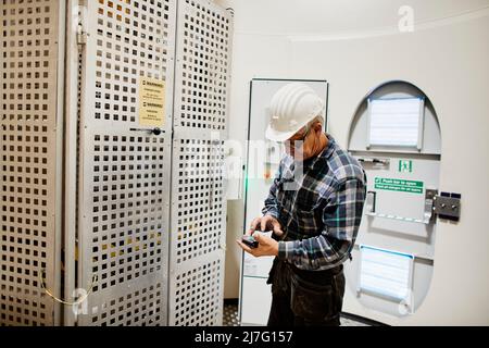 Engineer working in wind turbine Stock Photo