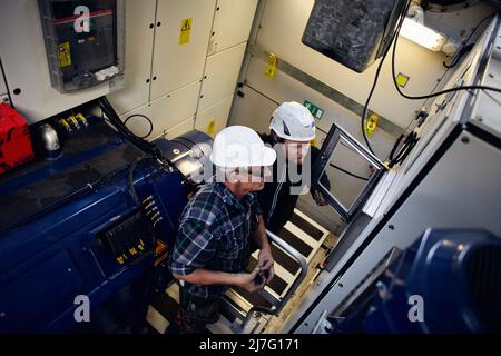 Engineers working in wind turbine Stock Photo
