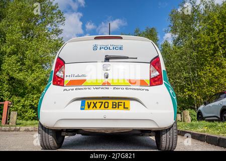 Close up rear view of new, electric, Zero Emission, Seat Mii police car, vehicle of West Mercia Police Force, UK, parked outdoors in spring sunshine. Stock Photo