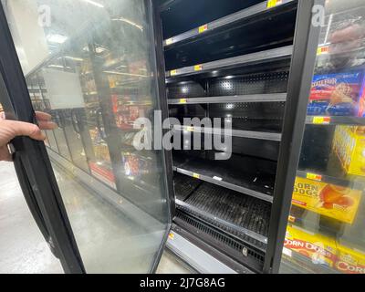 Grovetown, Ga USA - 04 20 22: Walmart freezer section empty shelves Stock Photo