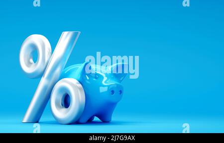 Blue piggy bank with percent sign on blue background Stock Photo