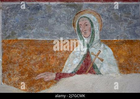 Santa con croce - affresco - pittore lombardo - 1507 - Mezzate di Bagnatica (Bg),italia, chiesa di San Pietro Stock Photo