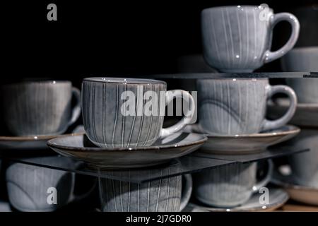 Close-up, beautiful grey ceramic cups with patterns. Stock Photo