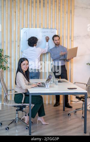 Female office worker posing for the camera in the workplace Stock Photo