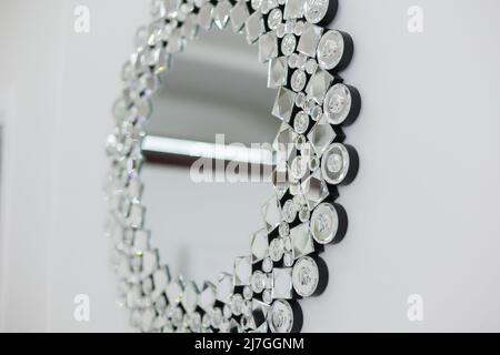 beautiful decorative mirror in crystals in the room on the wall Stock Photo