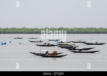 Satkhira, Bangladesh. 06th May, 2022. Bangladeshi villagers seen fishing on the boats in the Kholpatua river near the Sundarban forest at Shyamnagar in Satkhira district, Bangladesh. (Photo by Piyas Biswas/SOPA Images/Sipa USA) Credit: Sipa USA/Alamy Live News Stock Photo