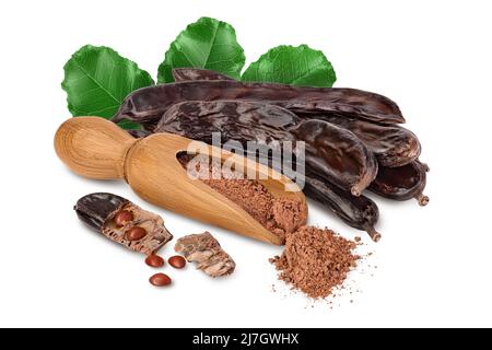 Carob pod and powder in wooden scoop isolated on white background with clipping path and full depth of field. Stock Photo