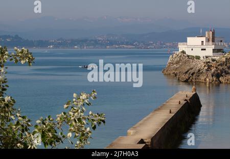 A traditional Cantabrian trainera racing rowing boat training in the bay of Santander Cantabria Spain on a sunny Spring morning Stock Photo