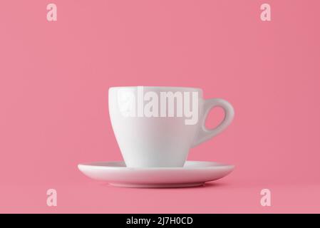 Mockup of a coffee cup isolated on pink background for logo or slogan insertion Stock Photo