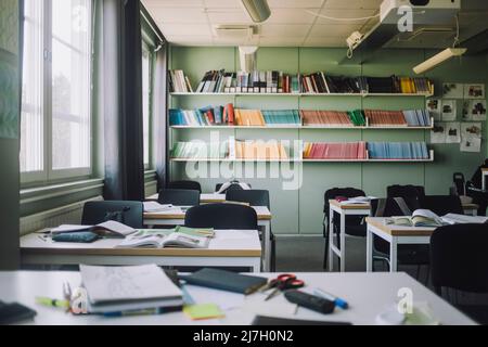 School supplies kept on desk in empty classroom Stock Photo