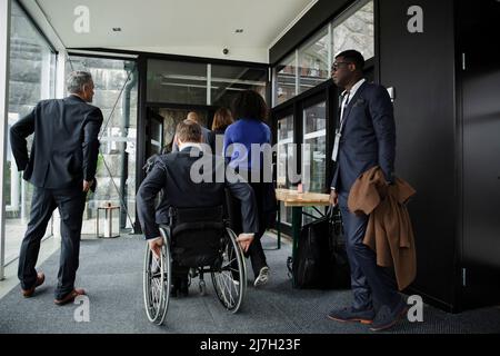 Business professionals entering conference center at convention center Stock Photo