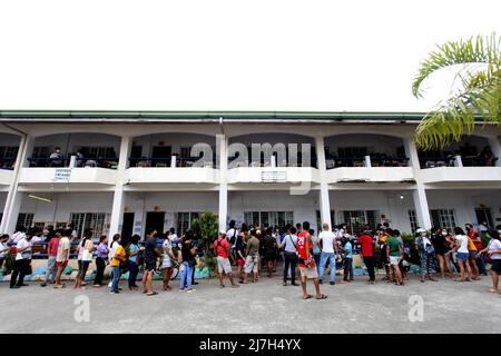 Voters Queuing Outside The School Building And Waiting Their Turn To ...