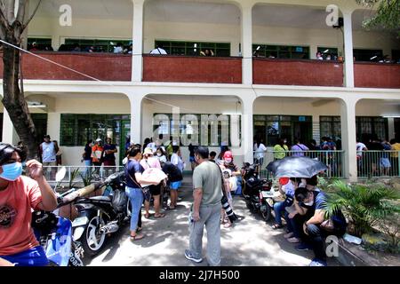 Voters Queuing Outside The School Building And Waiting Their Turn To ...