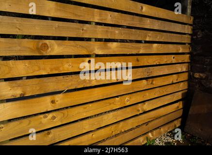 horizontal slats of a new  wooden fence Stock Photo