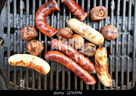 poilsh sausages and mushrooms on grill Stock Photo