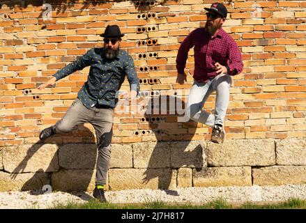 men with beards jump Stock Photo