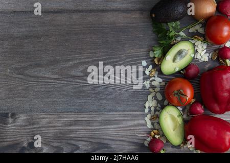 fork, spoon and knife on a wooden table Stock Photo