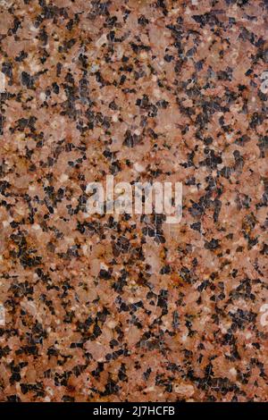 Background and texture granite stone with black inclusions Stock Photo